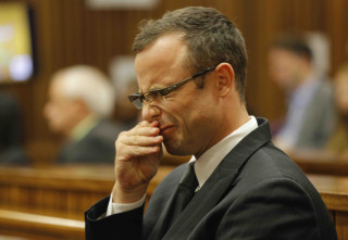 Oscar Pistorius tydens die hofverrigtinge op 11 Maart 2014 Foto: Kim Ludbrook/EPA/Pool (SAPA)