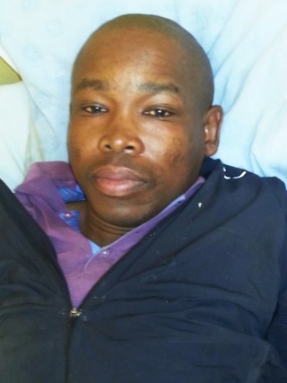 Alex Matsobane Maake in sy hospitaalbed. Foto: SAPD