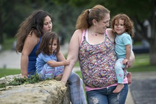 Sarah Robinson en drie van haar kinders Foto: Kansas City Star