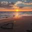 liefde-hart-strand-sonsondergangs-voetspore